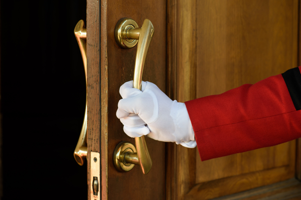 Doorman opening the door of a hotel
